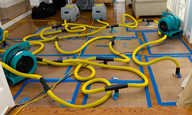 Professional Flood Damage Restoration technician working in Cohoes, NY